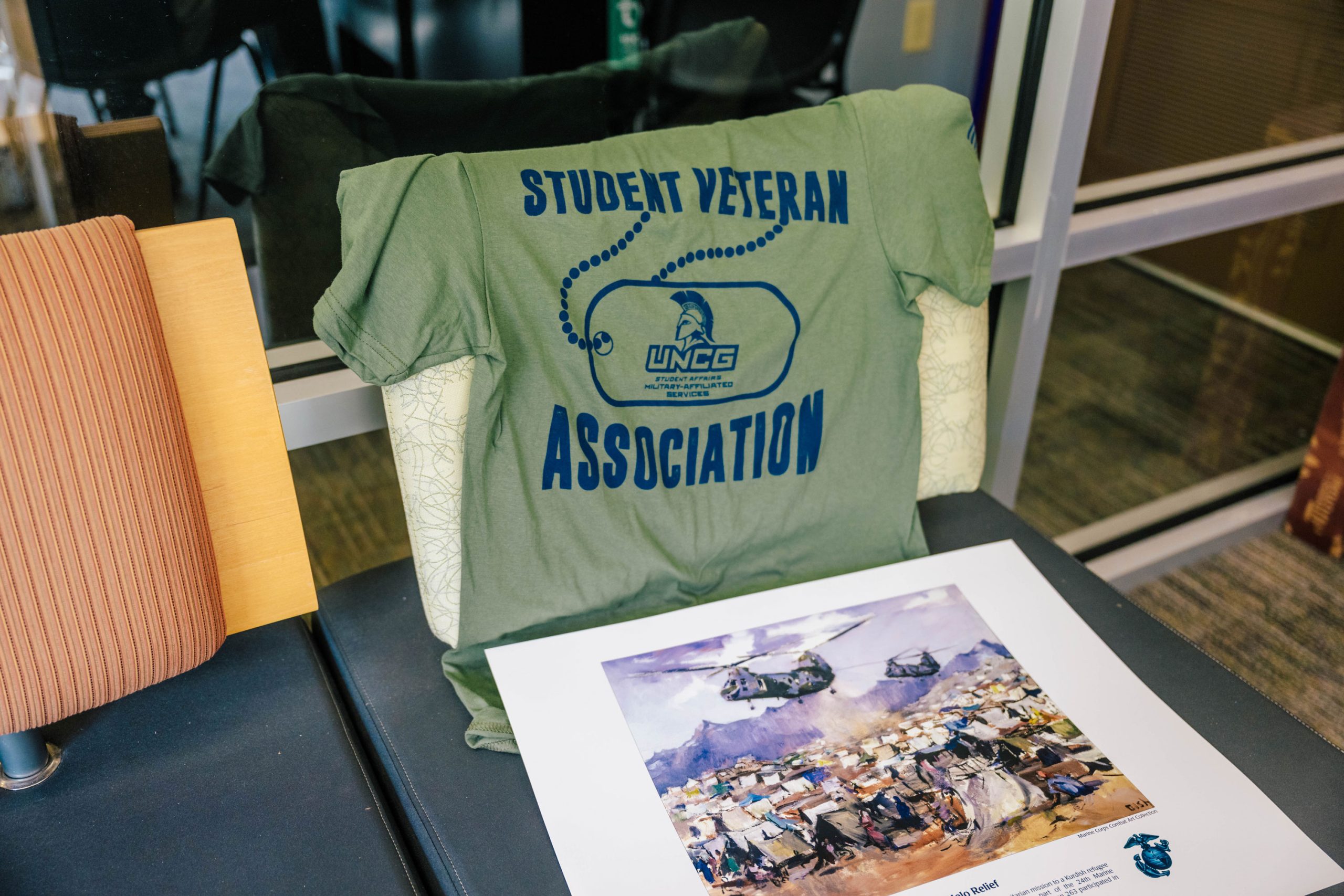 Wideman next to the Bod Pod, a machine that takes measurements of a child's body