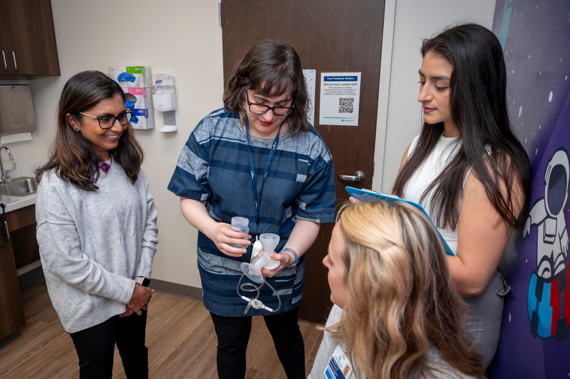 Dr. Jigna Dharod and Dr. Jasmine DeJesus are implementing an NIH-funded intervention to reduce obesity risk among Latine infants by supporting parents in breastfeeding. Here they meet with Cone Health collaborator Dr. Marjorie Jenkins and Julie Wenzel at the MedCenter for Women, where they will recruit participants for their pilot project.
